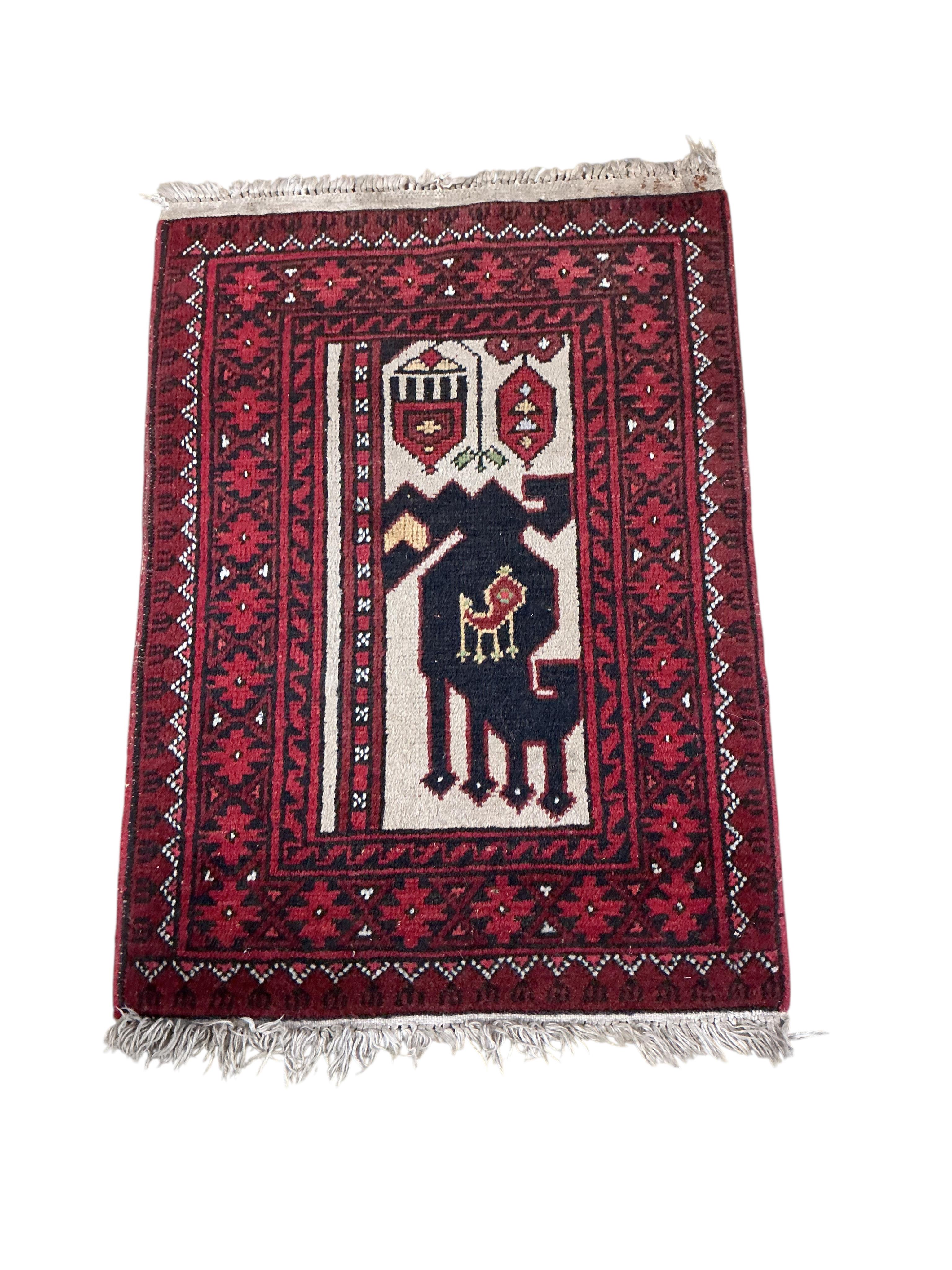 An Afghan blue ground rug 208 x 116cm, an Afghan mat and two Bokhara rugs